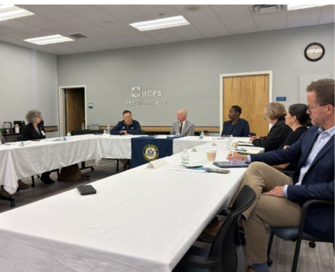 A group of policymakers around a conference table